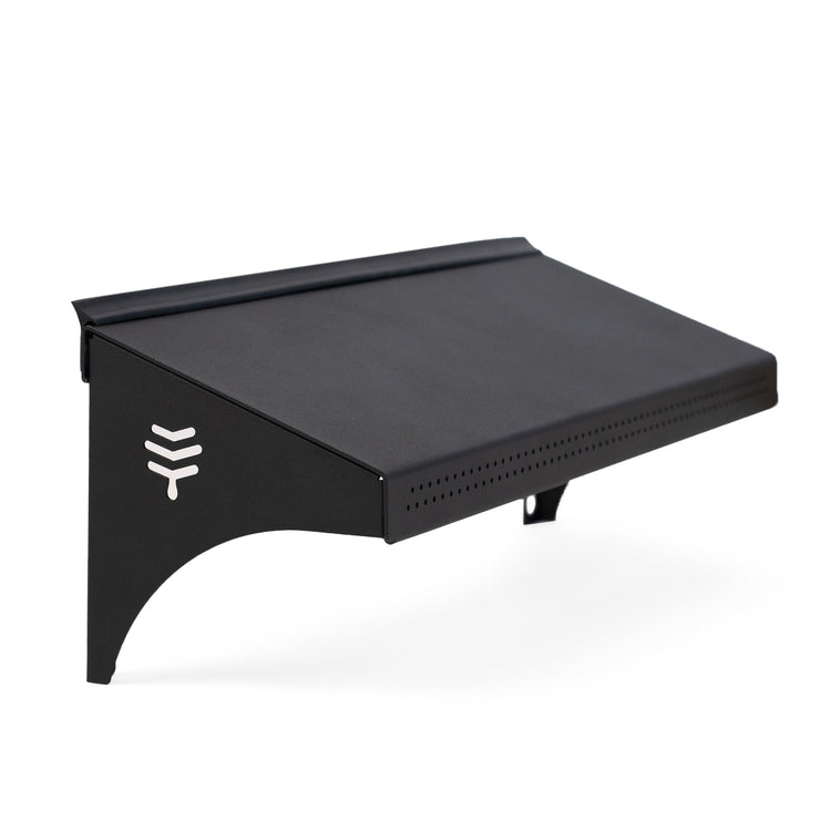 A black weather guard accessory for a hive, featuring the Flow brand logo on the side.